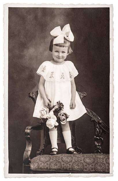 retro photo of little girl with flowers