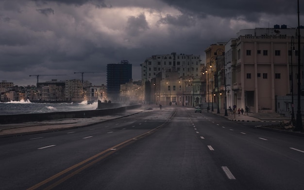 Road by sea in city during storm