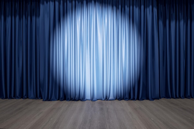 Rund spotlight på blå gardin på scenen med tregulv