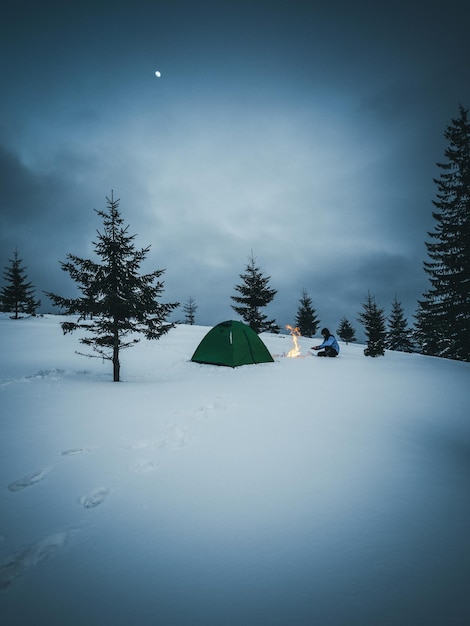 Scenic view of snow covered land against sky