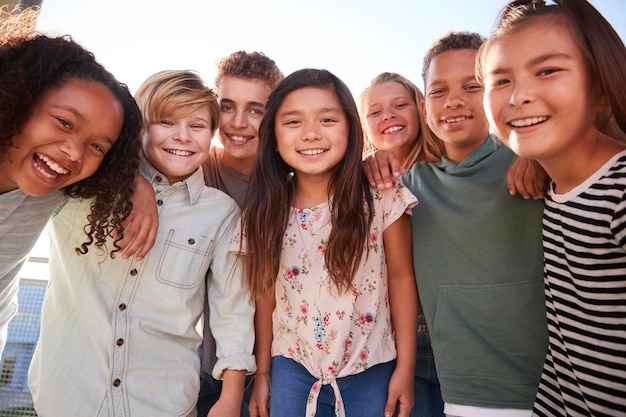 School kids hanging out during break smiling to camera