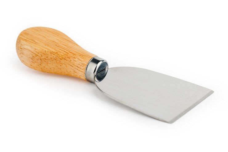 Foto set of cheese knives on a white isolated background.