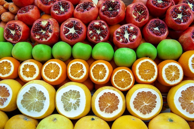 Set of fruits on the market from pomegranates and citrus