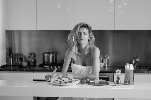 Sexy woman with ingredients for pizza cheese sausage and tomato sexy beautiful woman eat morning