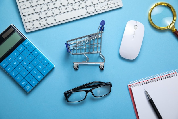 Shopping cart with a computer keyboard and business objects