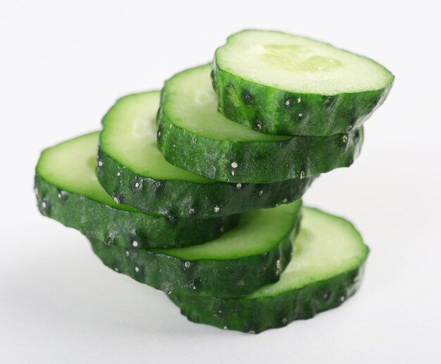 Sliced cucumbers isolated on white