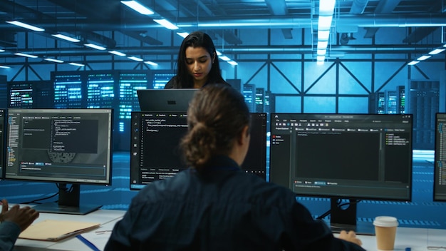 smiling admin in server hub checking recovery plan monitoring data center