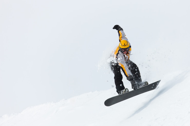 Foto snowboarder jumping