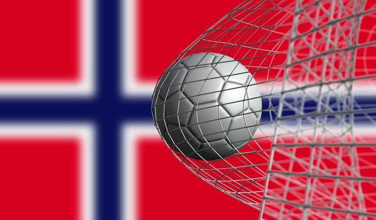 Foto soccer ball scores a goal in a net against norway flag 3d rendering
