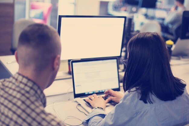 software developer writing programming code on laptop computer
