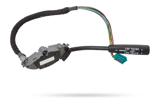 Steering wheel switches for cruise control disassembled on a white isolated background spare part for car repair or for sale at junk yard