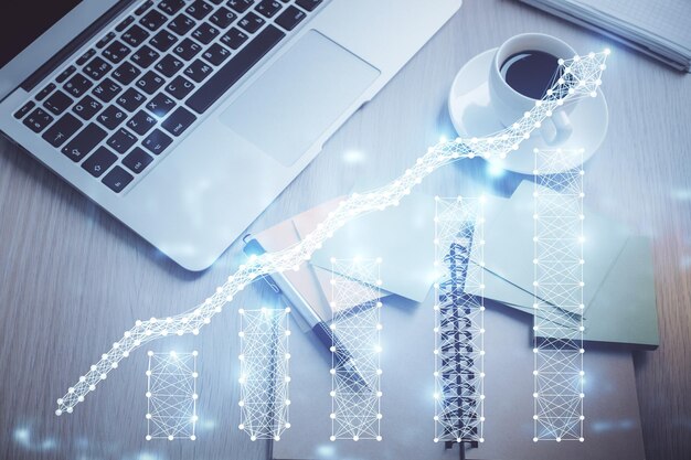 Stock market graph and top view computer on the table background Double exposure Concept of financial education