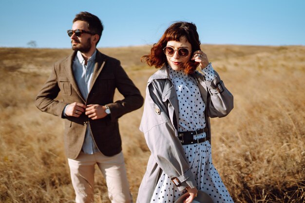 stylish and loving couple enjoying each other outdoors stylish couple walking and hugging