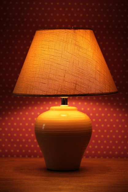 Table lamp on wallpaper background