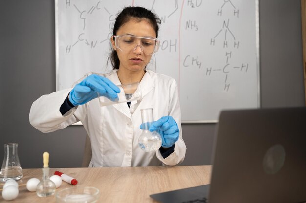 teaching chemistry and science in class online using laptop computer elearning and homeschooling