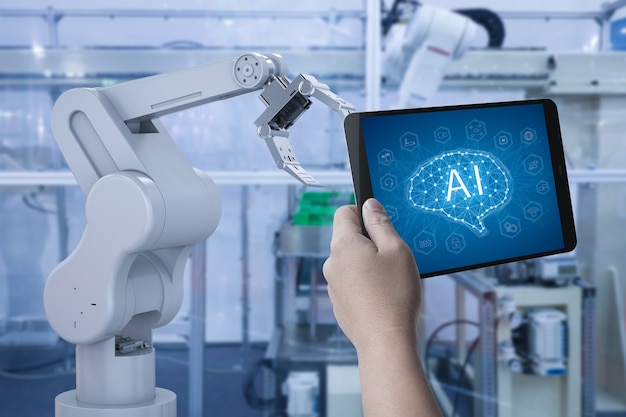 technician control 3d rendering robot arm in factory with tablet