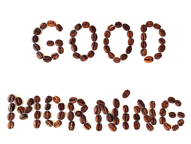 text made of coffee beans on white background