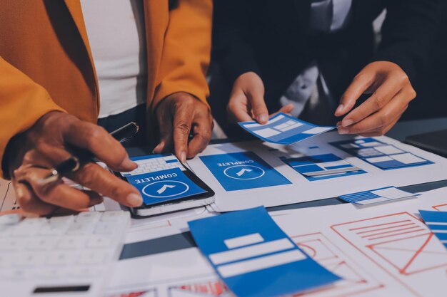 The designer team is designing the uxui system to make the uxui system work well on new phones and support system updates Website development concept UI UX front end designer