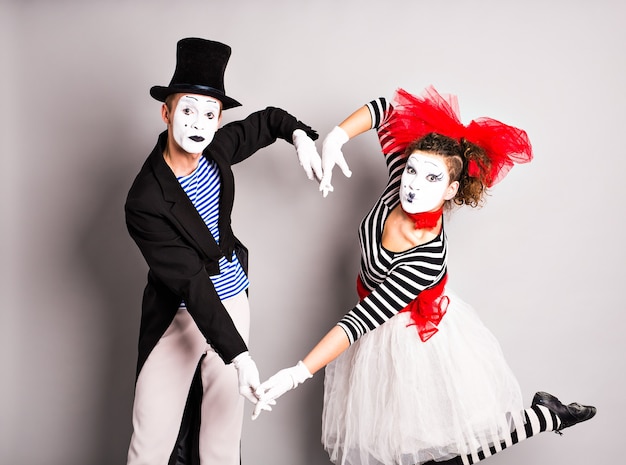 two mimes shows the heart. pantomime heart, love concept, april fools day concept.