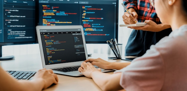 Two smart computer engineers working together to solve program code Burgeoning