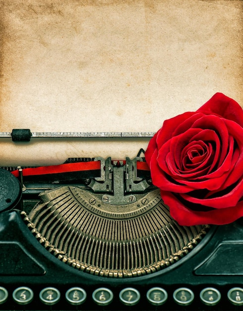 Vintage typewriter red rose flower Grungy paper