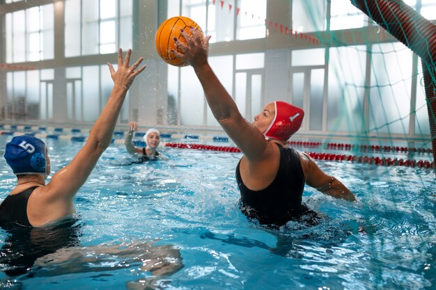 water polo players at the pool with swimming equipment