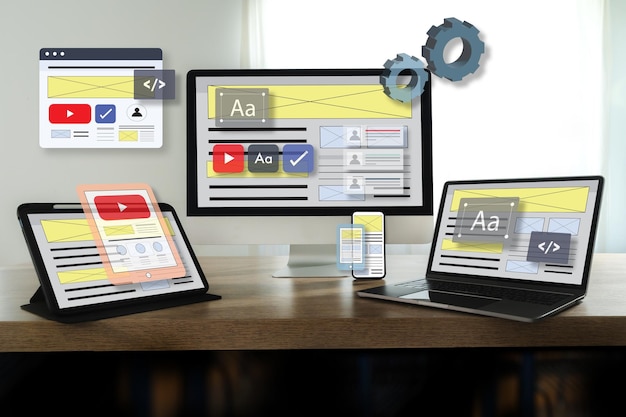 Website Internet Homepage UX developer and Designing a responsive website interface on a laptop at the office