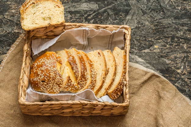 wheat bread on natural linen napkin and bag. Homemade bakery. Still life of bread. Slice o