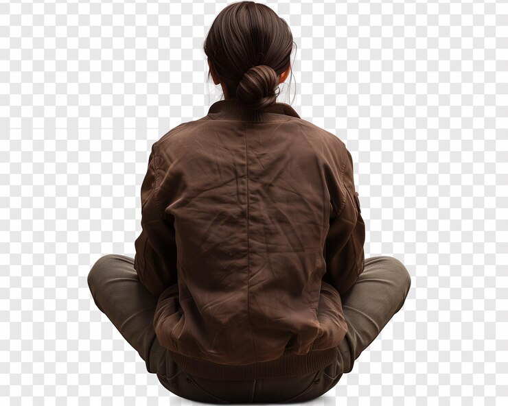 Woman in Brown Jacket Sitting in Meditative Pose