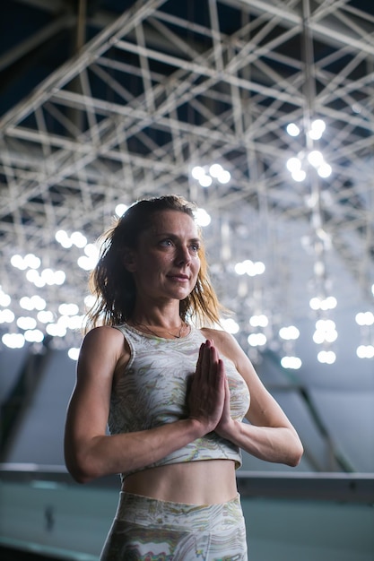 Yoga meditation pose under light bulbs
