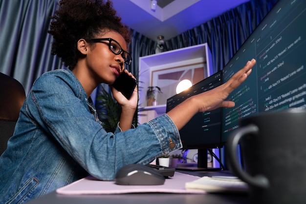 Young African American IT developer concentrating on monitor screen laptop with codding program in data of application and website Concept of creating innovative html updated version Tastemaker