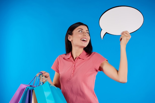 Young beautiful woman holding paper bags