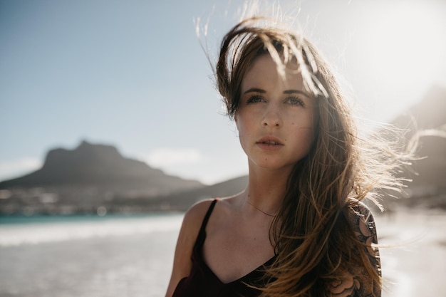 young woman standing at beach