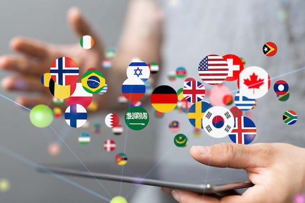 3D rendering of country flags over hand holding computer tabletglobal communication concept
