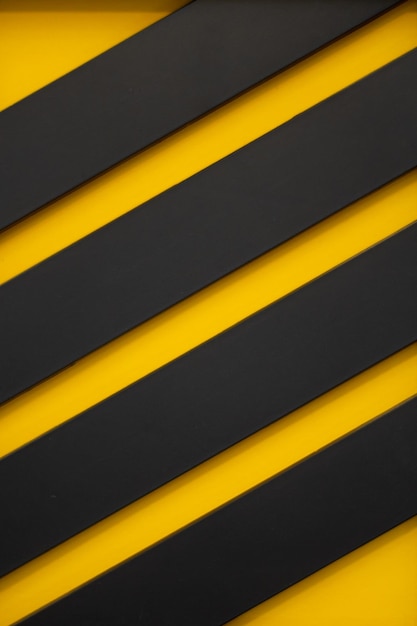a black and yellow striped wall with a yellow stripe
