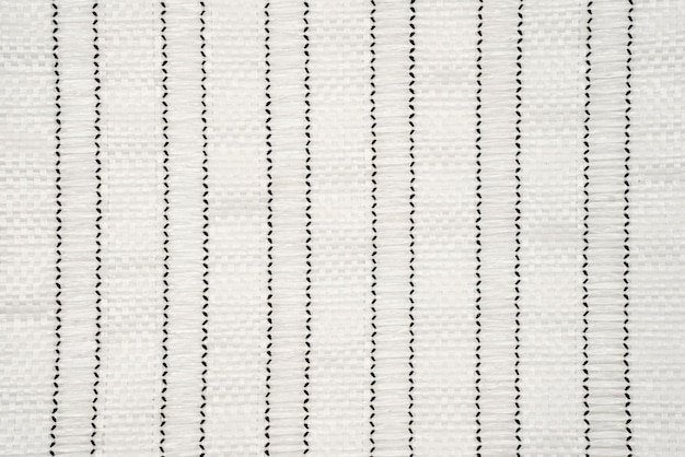 a close up of a rug with a black and white striped pattern