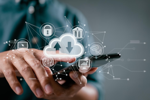 A guy operates a smartphone while holding a cloud computing diagram Data storage networking and internet service principles are all part of the cloud technology concept
