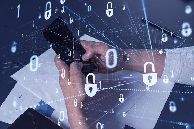 a programmer is browsing the internet in smart phone to protect a cyber security from hacker attacks and save clients confidential data padlock hologram icons over the typing hands