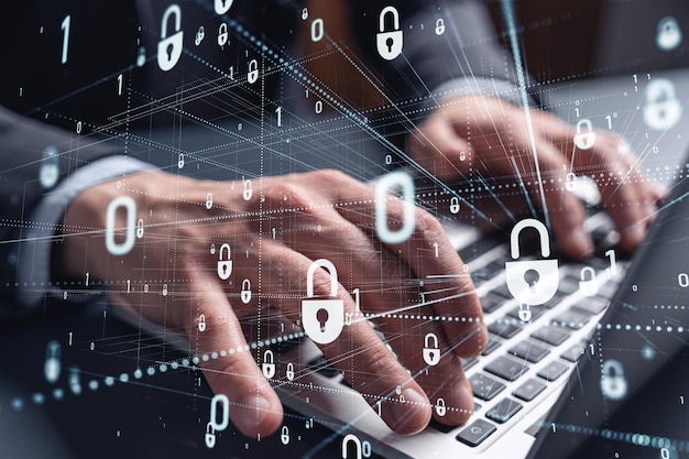 a programmer is typing a code on computer to protect a cyber security from hacker attacks and save clients confidential data padlock hologram icons over the typing hands formal wear