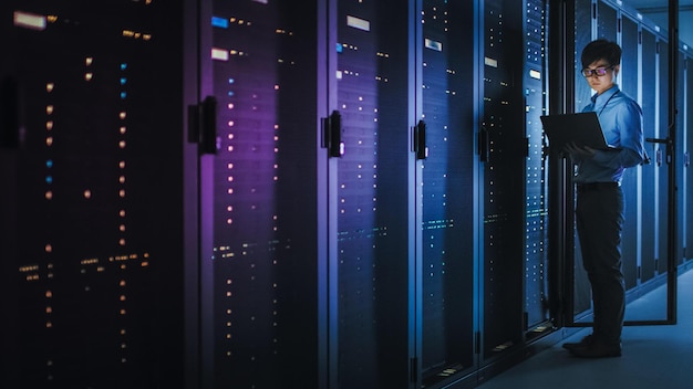 a server room with a blue light that is lit up.