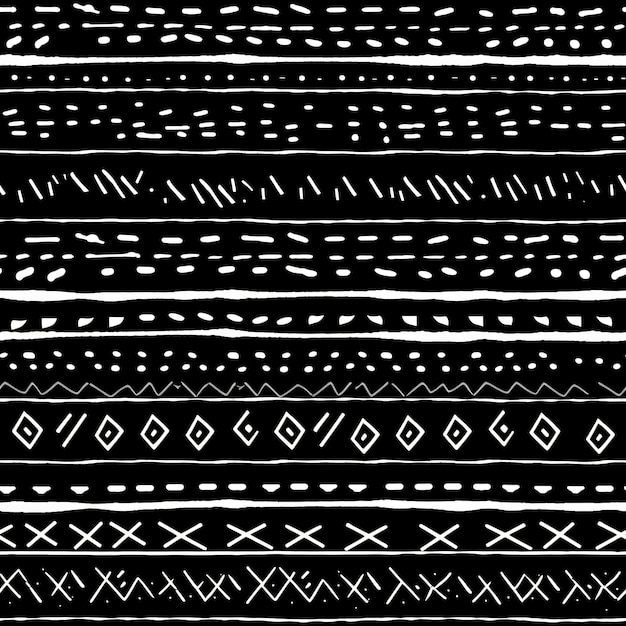 a white tribal type border on a black fabric in the