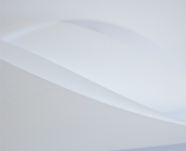 Abstract background of a twisted sheet of white paper