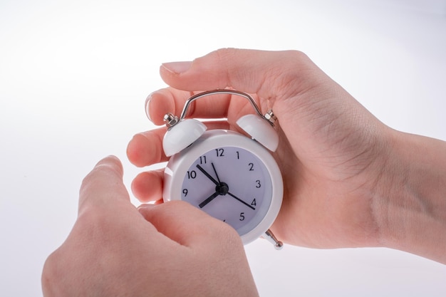 Alarm clock in hand