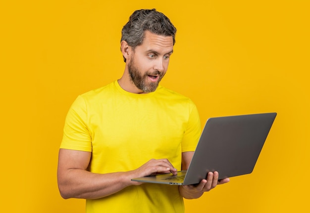 amazed man blogger isolated on yellow man blogger on background man blogger in studio