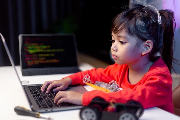 asia students learn at home in coding robot cars and electronic board cables in stem steam mathematics engineering science technology computer code in robotics for kids concept
