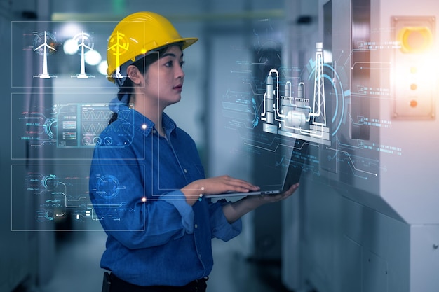 Asian Women Engineer checking facility system in factory and using technology