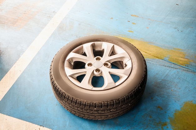 Auto tire replacement at car service centre repair shop