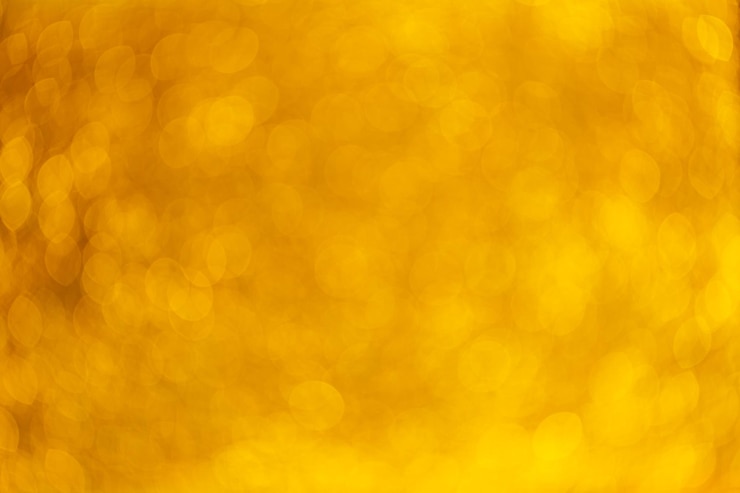 Bild beautiful festive golden abstract background with bokeh lights for design