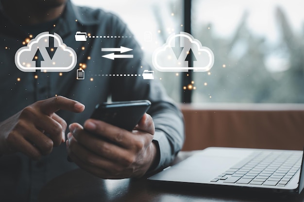 Big data analytics and business intelligence concept with chart and graph icons on computer screen interface and businessman analyzing data in background Cloud computing