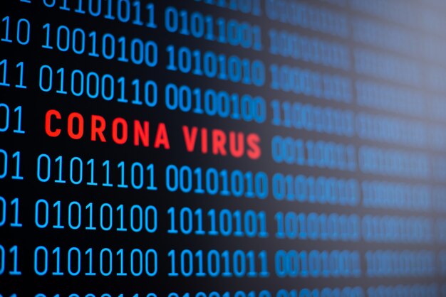 binary code on computer screen with inscription coronavirus in the middle of the code. symbol of coronavirus outbreak